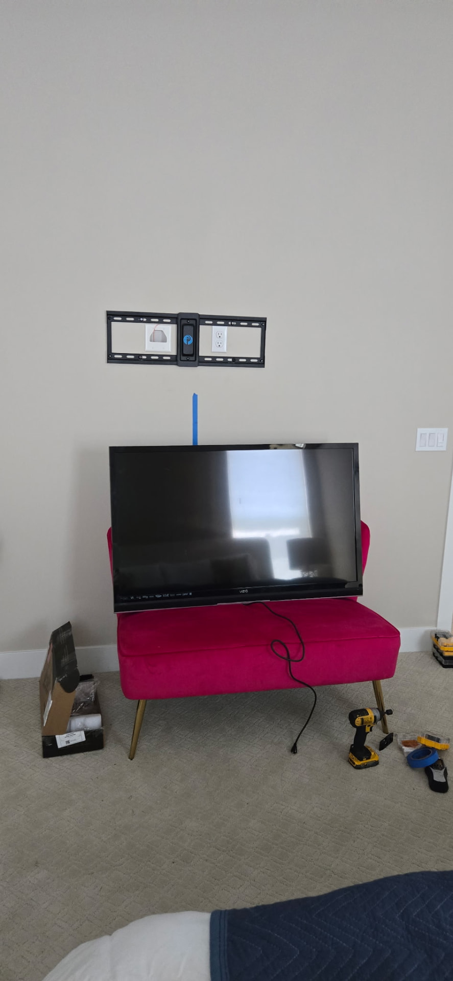TV wall mount installed and TV ready to hang